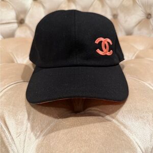 CHANEL Black Cap with Coral CC Emblem